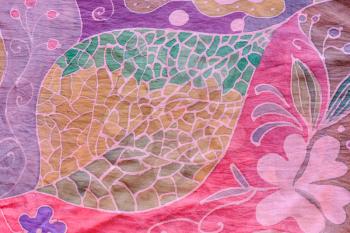 textile background - abstract hand painted leaf on pink and purple silk batik