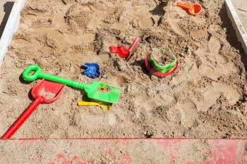 outdoor sandbox with toys on children playground