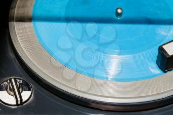 blue transparent flexi disc in old record player