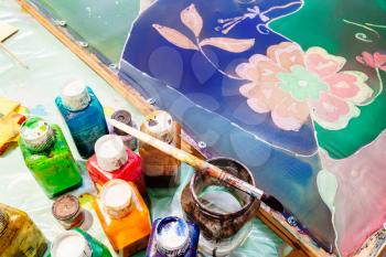 wax paints, brush and painted silk batik in workshop