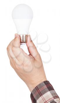 hand holds compact LED lamp isolated on white background