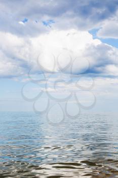white clouds over calm water of Azov Sea, Temryuk bay, Golubitskaya resort, Taman peninsula, Kuban, Russia