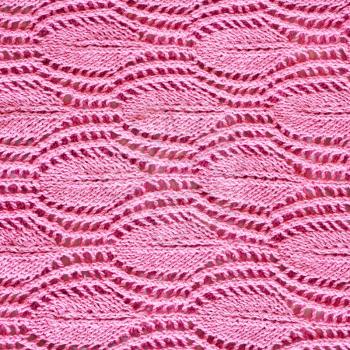 hand-knitted pink pattern close up knitted with cotton thread