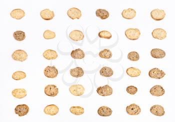 many sliced bread baguettes on white background