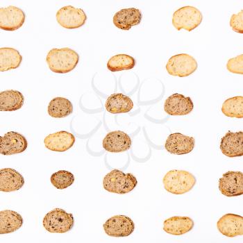 lot of sliced bread baguettes on white background