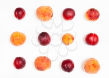 set from ripe nectarines and peaches on white background