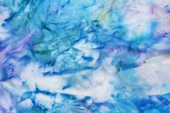textile background - abstract blue and violet painted silk batik