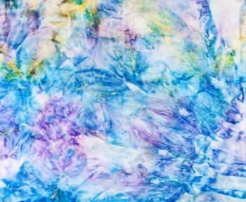textile background - abstract blue colored stitched silk batik