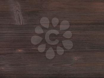 textured background - wooden surface of dark brown color close up