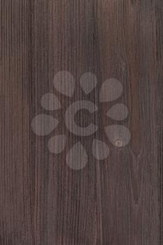 textured vertical background - wooden board of dark brown color