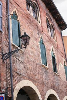 travel to Italy - facade of old house in historical area of Verona city