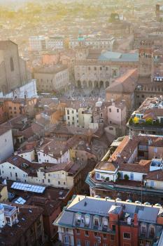 travel to Italy - above view of houses and piazza maggiore in Bologna city from Torre Asinelli ( Asinelli Tower) at sunset