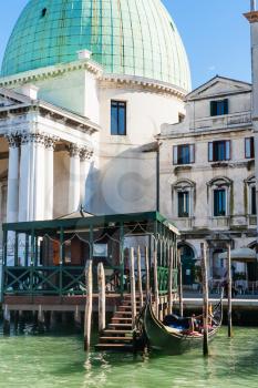 travel to Italy - gondolas stop near Church San Simeone Piccolo (San Simeone e Giuda) in Venice
