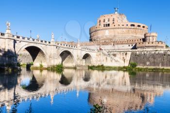 travel to Italy - scenery with Castel Sant Angelo (Castle of the Holy Angel, Mausoleum of Hadrian) and bridge of St Angel in Rome city from Tiber river in sunny day