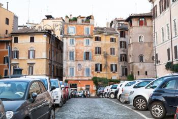 travel to Italy - street with old houses and car parking in medieval district of Rome city (Vicolo della Moretta)