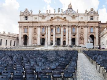 travel to Italy - chairs on piazza San Pietro and view of Papal Basilica of St Peter in Vatican city
