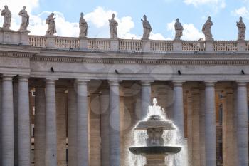 travel to Italy - Maderno's fountain illuminated by sun and colonnade on piazza San Pietro in Vatican city