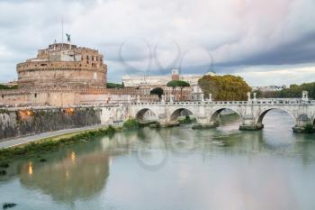travel to Italy - Tiber River, Castle of the Holy Angel ( Castel Sant Angelo, Mausoleum of Hadrian) and St Angel bridge in Rome city in autumn evening twilight