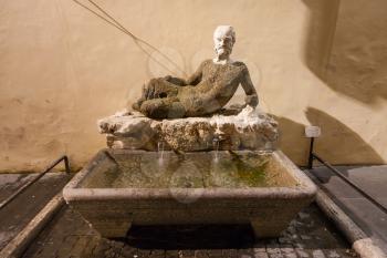 travel to Italy - ancient fountain Babuino with roman statue on Via del Babuino in Rome city in night