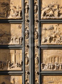travel to Italy - fragment of outdoor East doors of Baptistery (Battistero di San Giovanni, Baptistery of Saint John), the doors are copy of Gates of Paradise made by Lorenzo Ghiberti in Florence city