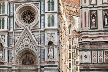 travel to Italy - decorated wall of Duomo Cathedral Santa Maria del Fiore and Giotto's Campanile in Florence city