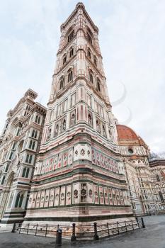 travel to Italy - Giotto's Campanile and Florence Duomo Cathedral (Cattedrale Santa Maria del Fiore, Duomo di Firenze, Cathedral of Saint Mary of the Flowers) on Piazza del Duomo in morning