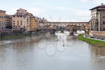 travel to Italy - view of Ponte Vecchio (Old Bridge) over Arno River in Florence city in autmun evening