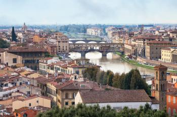 travel to Italy - above view city and of ponte vecchio (old bridge) in Florence from Piazzale Michelangelo in autumn evening