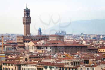 travel to Italy - above view of Palazzo Vecchio (Old Palace, Town Hall) in Florence city from Piazzale Michelangelo in autumn evening