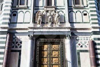 travel to Italy - wall of Baptistery (Battistero di San Giovanni, Baptistery of Saint John) with East doors, or Gates of Paradise made by Lorenzo Ghiberti in Florence city