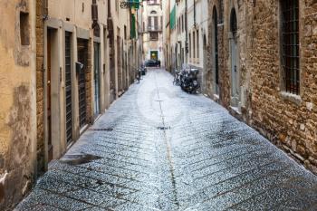 travel to Italy - wet street in old residential district of Florence city in autumn rain