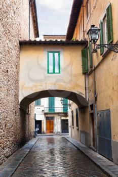 travel to Italy - arch on old street in Florence city in Oltrarno district in autumn day