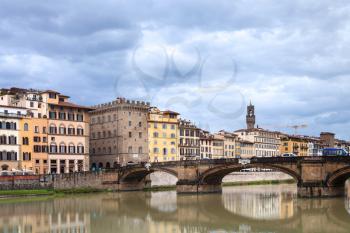 travel to Italy - Ponte Santa Trinita over Arno river Florence city in autumn rainy day