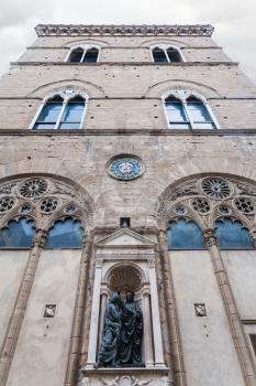 travel to Italy - building of medieval Orsanmichele church with statue Christ and St Thomas in Florence city