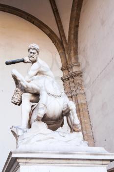 travel to Italy - statue hercules and nessus on Piazza della Signoria in Florence city. Hercules beating the Centaur Nessus is marble sculpture by Pietro Francavilla in 1599