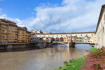 travel to Italy - Ponte Vecchio (Old Bridge) over Arno river in Florence city in sunny autumn day