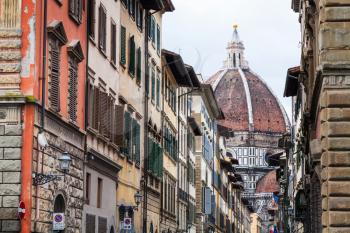 travel to Italy - view of Cathedral Santa Maria del Fiore trough street Via dei Servi in Florence city