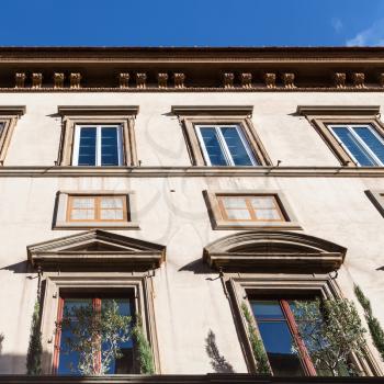 travel to Italy - facade of apartment house illuminated by sun in Florence city