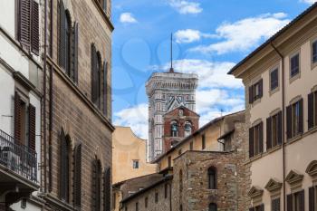 travel to Italy - Giotto's Campanile and bell tower over urban houses in Florence city
