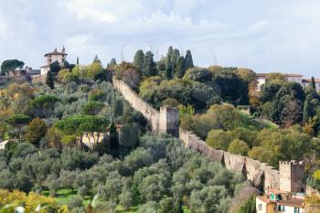 travel to Italy - above view of green gardens and wall of Giardino Bardini from Piazzale Michelangelo in Florence city in autumn