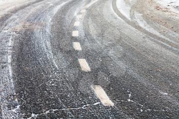 turn on a slippery frozen road in winter day