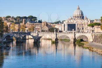 travel to Italy - Rome and Vatican city view from Ponte Umberto I, with Basilica St. Peter's, Tiber river, Ponte Sant' Angelo (Bridge of Holy Angel) in autumn