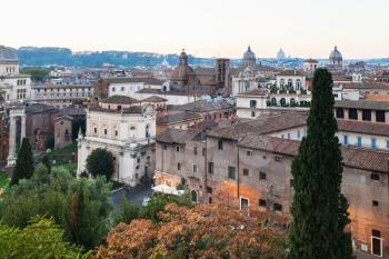 travel to Italy - view of buildings of old Rome city from Capitoline hill in evening