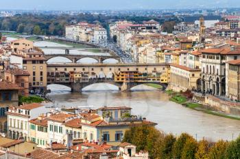 travel to Italy - above view of Ponte Vecchio in Florence town from Piazzale Michelangelo