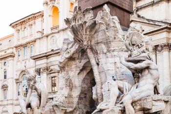 travel to Italy - sculptures of Fontana dei Quattro Fiumi (Fountain of the Four Rivers) and sant agnese church on background on Piazza Navona in Rome city