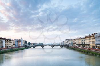 travel to Italy - Arno River with Ponte alla Carraia bridge in Florence city in evening twilight