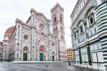 travel to Italy - Florence Duomo Cathedral (Cattedrale Santa Maria del Fiore, Cathedral of Saint Mary of the Flowers), Giotto's Campanile and Baptistery on Piazza San Giovanni in morning