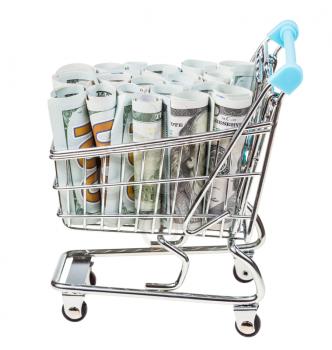 shopping cart with rolls from dollar banknotes isolated on white background