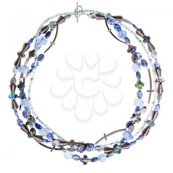 top view of round necklace from lapis lazuli and sodalite natural gem stones, glass, nacre and metal beads isolated on white background