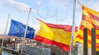Catalan, Spanish, EU flags flutter over Barcelona city
